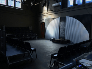 La Mama. Image is an empty performance space in an old adapted courthouse.